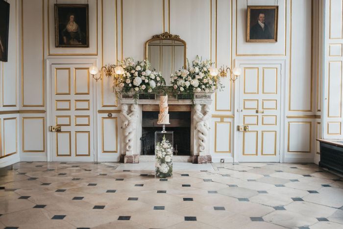 Stunning set up of 3 tier wedding cake at Gosfield Hall in Essex