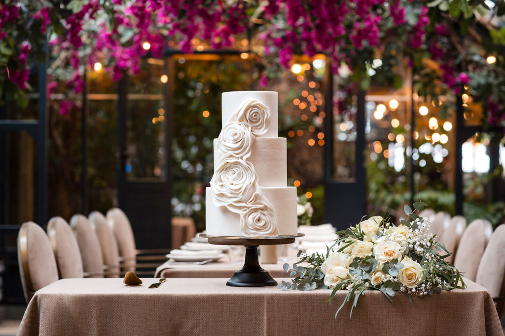 3 tier white on white textures wedding cake with contemporary rosette style rose cascade