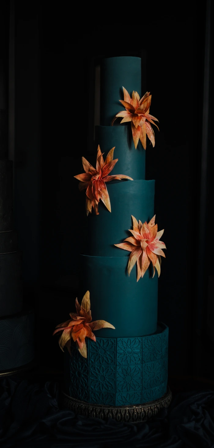 Wedding cake with a mixture of real cake and faux tiers