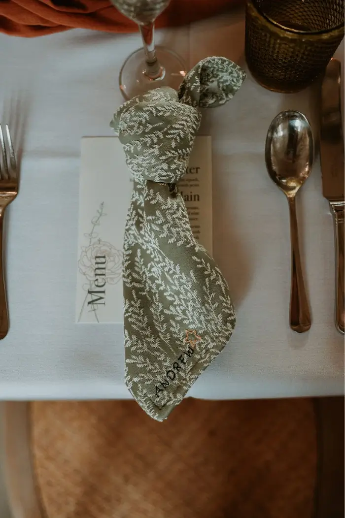 Personalised wedding napkins doubling up as name places