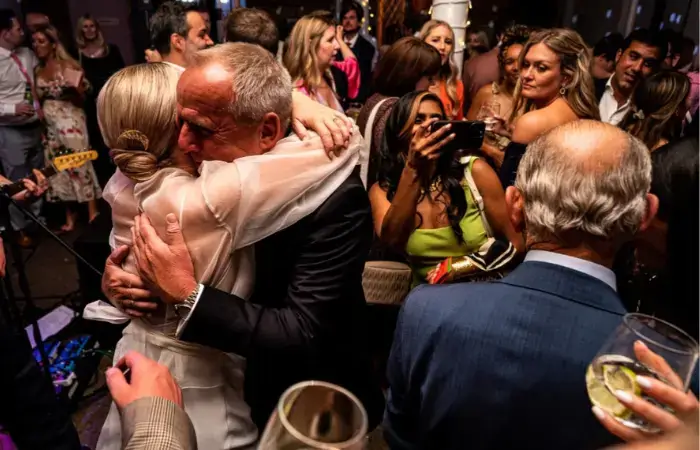 Emotion hug captured at wedding reception at 100 Barrington Brixton