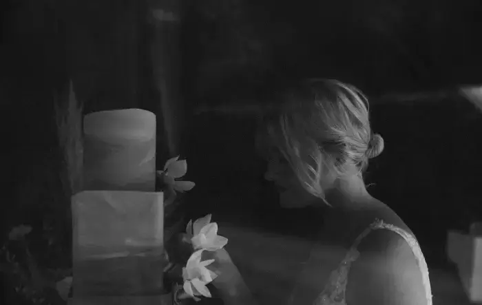 Bride with wedding cake wedding photographer surrey