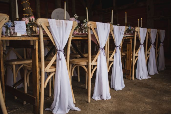 Lilac wedding chair sashes tied with ribbon in Surrey