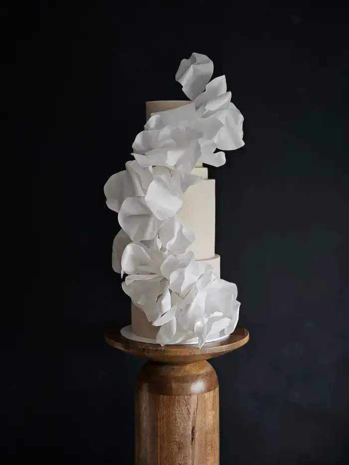 3 tier textured in subtle blush tones with contemporary wafer paper ruffle sails Essex
