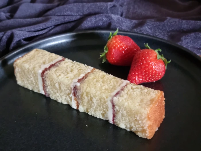 Buttercream filled wedding cake slice