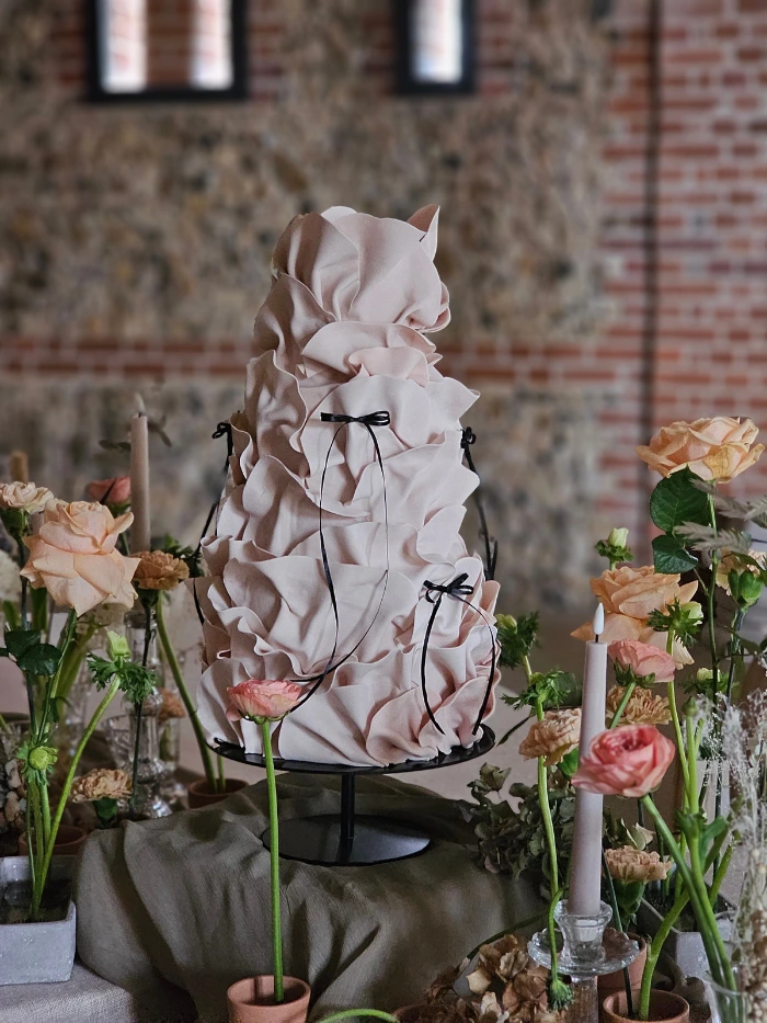 Mocha Mousse contemporary ruffle wedding cake with black bow ribbon detail