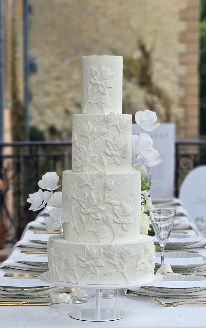 Contemporary magnolia textured white 4 tier wedding cake with abstract wafer paper flowers Stansted Park, Hampshire