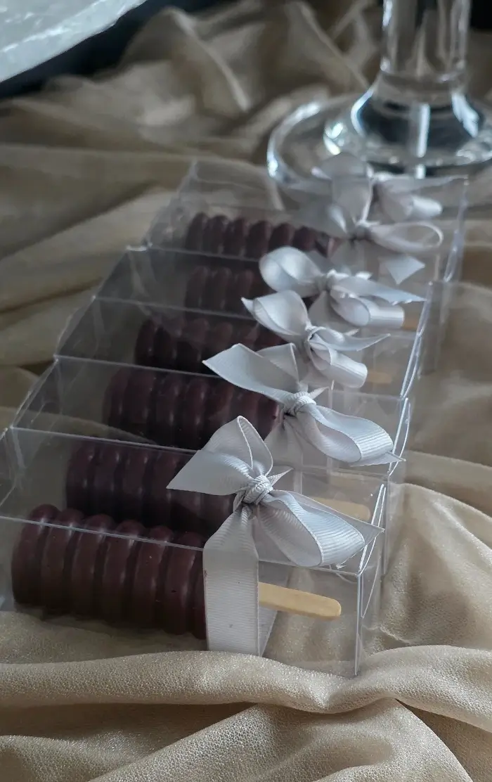 Cakesicle style wedding favours in deep burgundy and silver colour theme