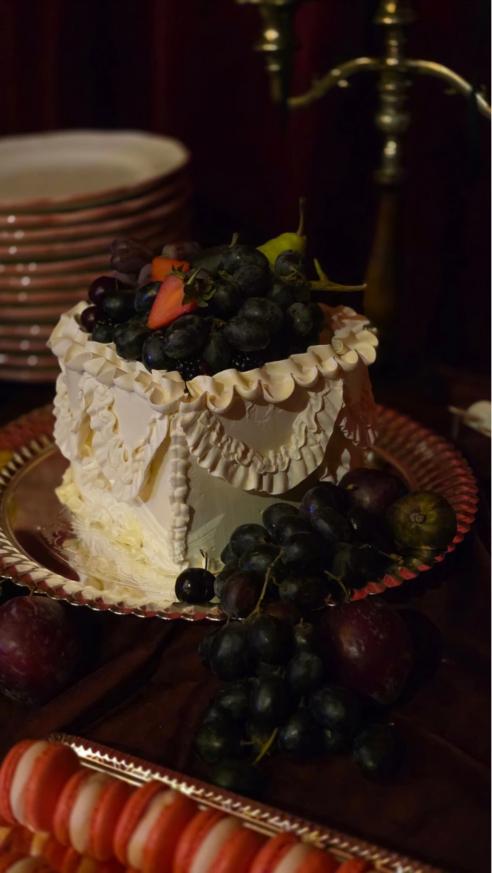 Heart shape vintage piped buttercream cake as part of a wedding cake dessert table at Wilderness Reserve Suffolk