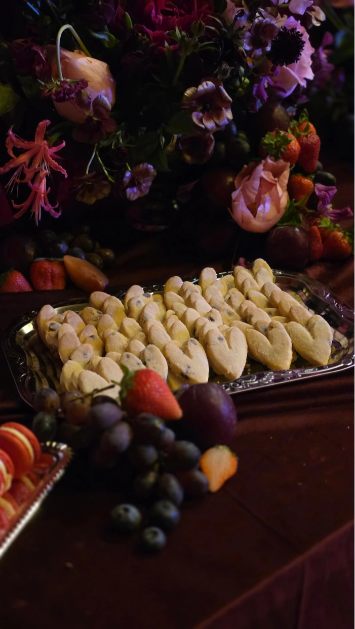 Mini chocolate chip heart shaped shortbread biscuits as part of a wedding dessert table at Wilderness Reserve Suffolk