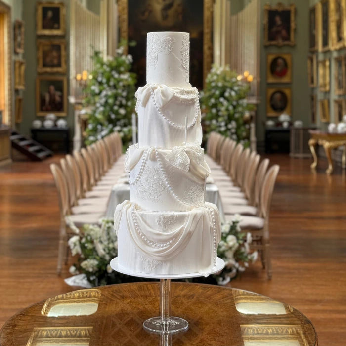 700 x 700 Button images (1) Statement white modern 4 tier wedding cake at Somerley House, Hampshire