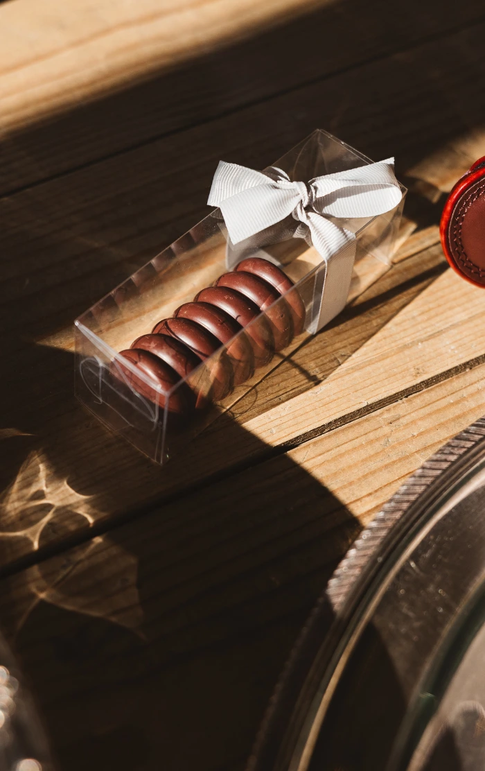 Belgium milk chocolate cake pop wedding favour in burgundy and silver colour theme at The Barn on Botley Hill